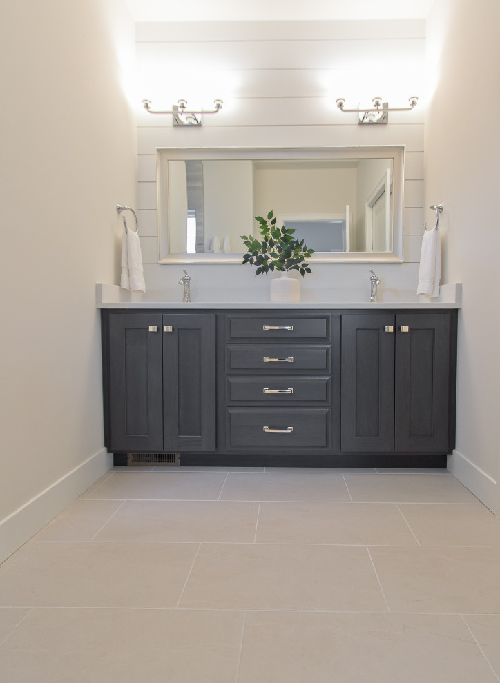 Inspiration for a transitional ceramic tile, beige floor and shiplap wall bathroom remodel with raised-panel cabinets, dark wood cabinets, a built-in vanity, quartz countertops and white countertops
