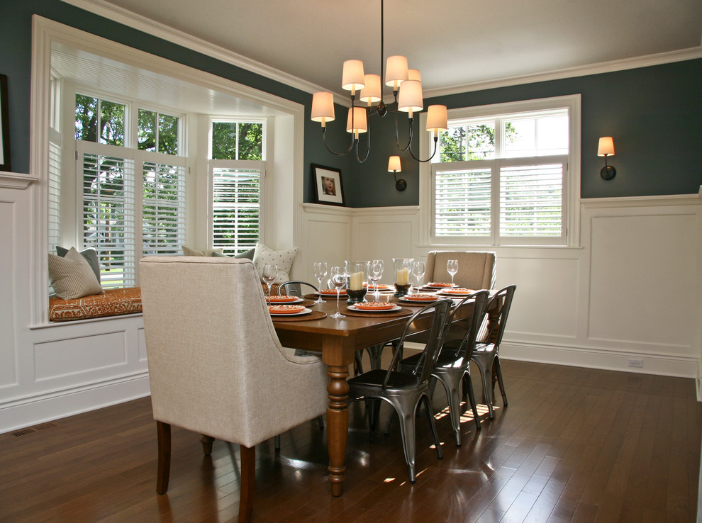 Photo of a large transitional kitchen/dining combo in Grand Rapids with green walls and dark hardwood floors.