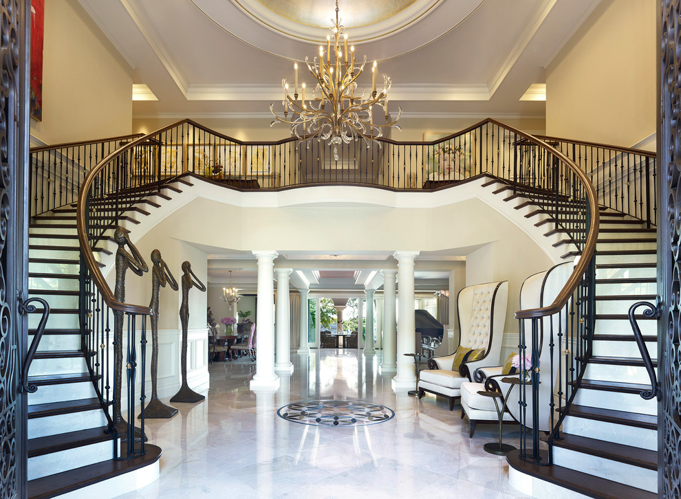 Photo of a traditional foyer in Tampa with beige walls and beige floor.