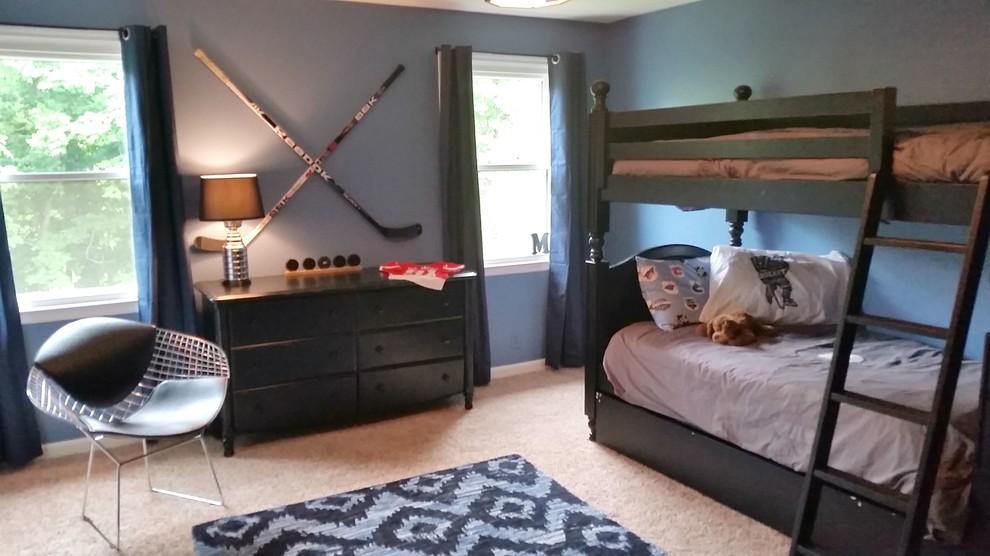 This is an example of a transitional bedroom in Nashville with blue walls.