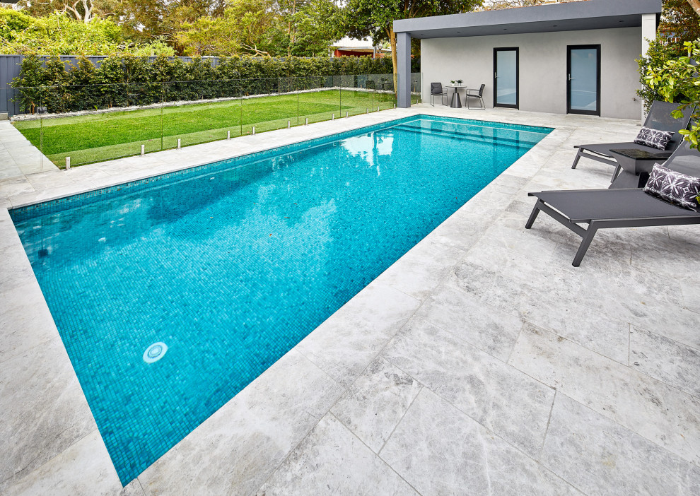 Design ideas for a contemporary backyard rectangular pool in Sydney with tile.