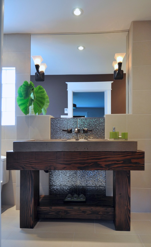 Inspiration for a mid-sized eclectic master bathroom in Ottawa with a trough sink, flat-panel cabinets, beige cabinets, engineered quartz benchtops, an alcove shower, a one-piece toilet, beige tile, porcelain tile, brown walls and porcelain floors.