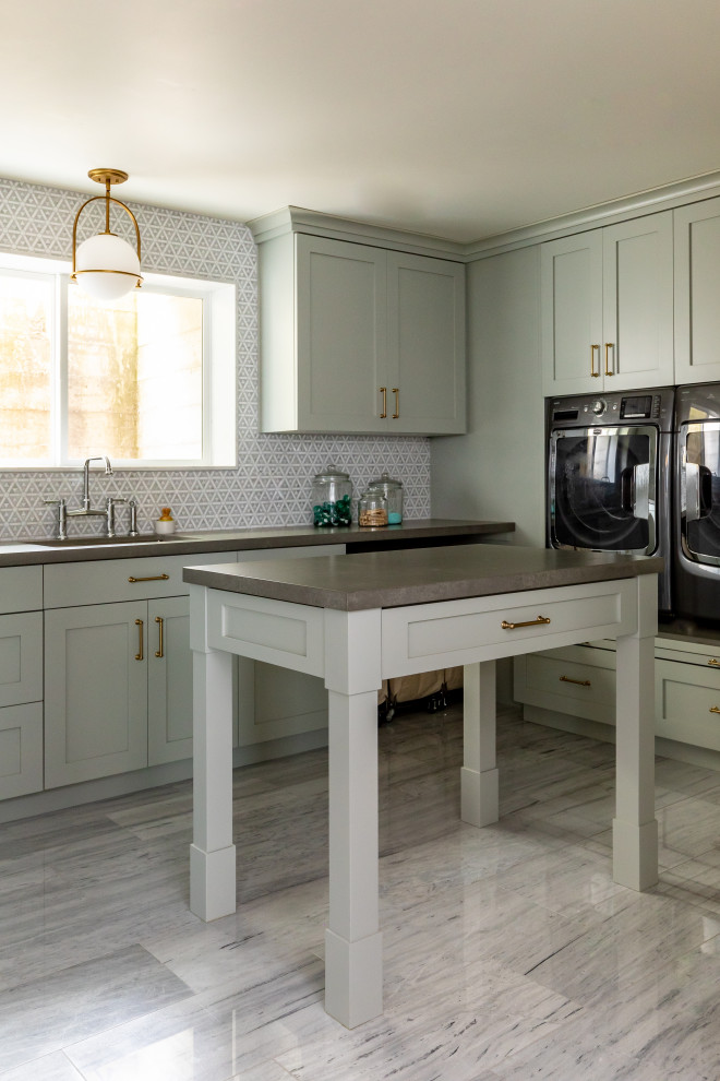 Inspiration for a large u-shaped dedicated laundry room in Salt Lake City with an undermount sink, shaker cabinets, green cabinets, quartzite benchtops, mosaic tile splashback, marble floors, an integrated washer and dryer, grey floor and grey benchtop.