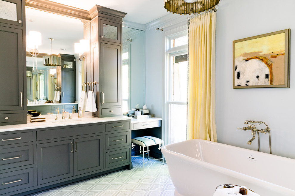 Example of a large transitional master freestanding bathtub design with shaker cabinets, gray cabinets, white walls, an undermount sink, quartz countertops and white countertops