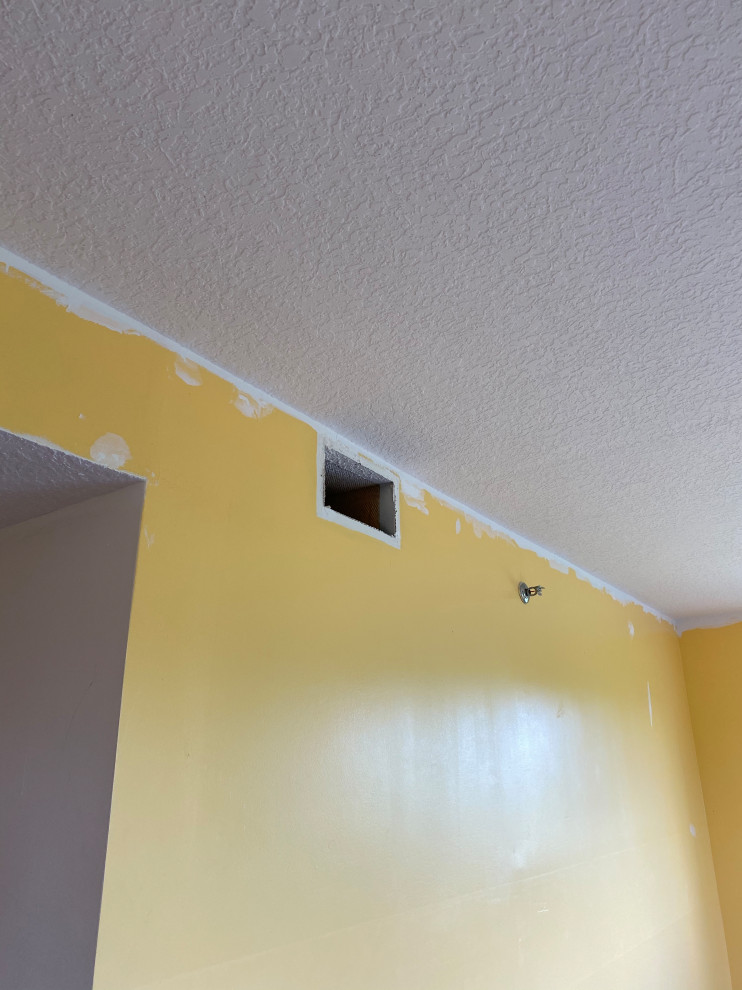 Ceiling paint turned yellow and corners different shade of white?