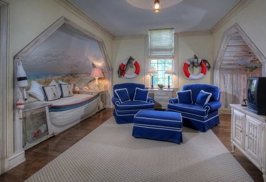Large nautical teen’s room for boys in Las Vegas with beige walls and medium hardwood flooring.
