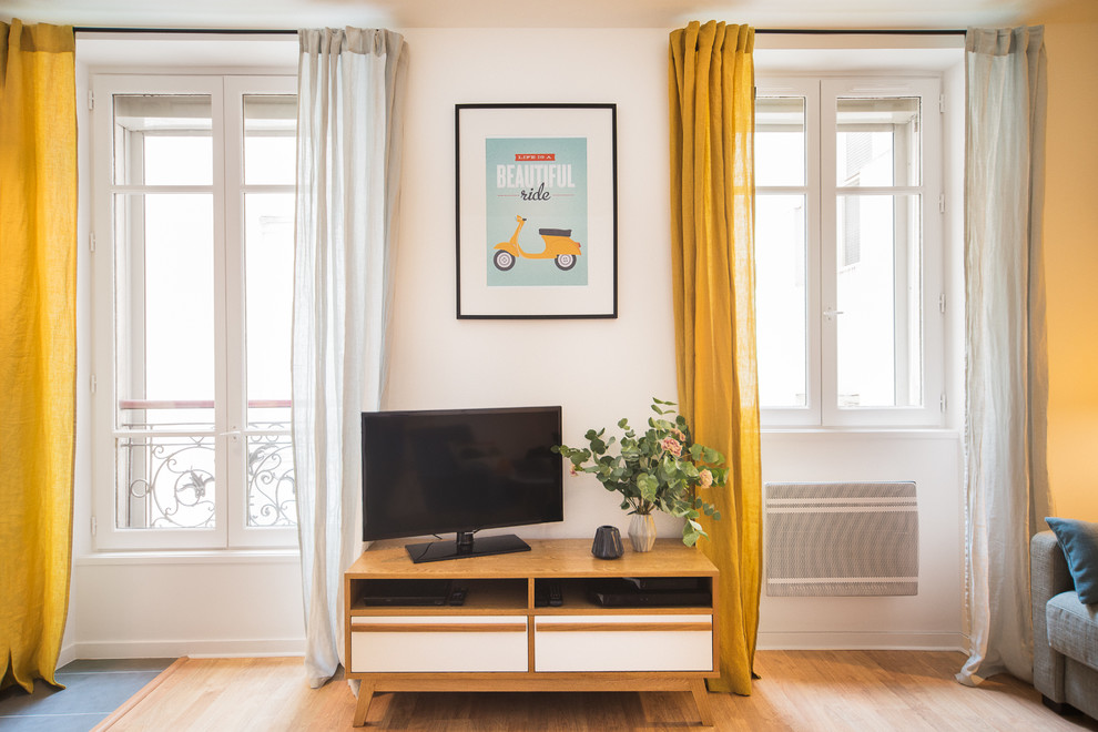 Photo of a scandinavian family room in Paris.