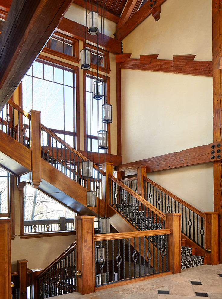 Staircase - rustic wooden staircase idea in Denver with wooden risers