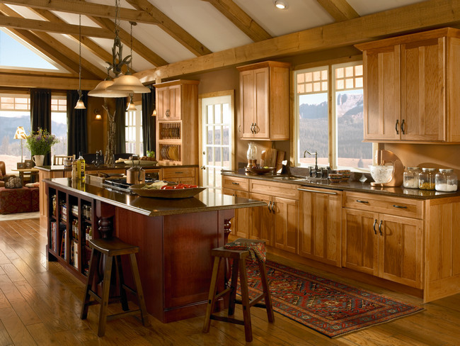 Photo of a country kitchen in Other with recessed-panel cabinets.