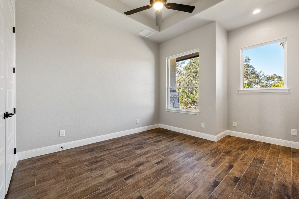 Transitional bedroom photo in Austin