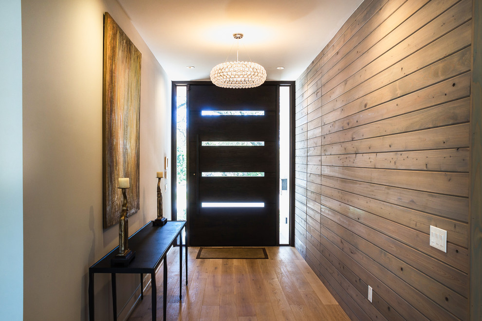 Large transitional light wood floor front door photo in Austin with a dark wood front door and gray walls