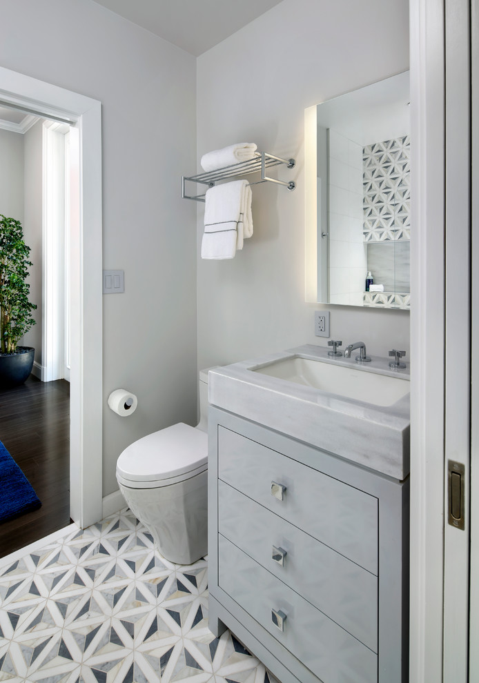 Design ideas for a mid-sized contemporary 3/4 bathroom in San Francisco with flat-panel cabinets, grey cabinets, an alcove tub, a shower/bathtub combo, a one-piece toilet, gray tile, white tile, cement tile, grey walls, cement tiles, an undermount sink, marble benchtops, multi-coloured floor and an open shower.