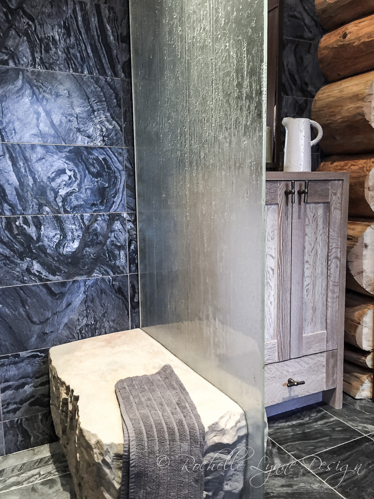 Example of a large mountain style master slate floor walk-in shower design in Calgary with shaker cabinets