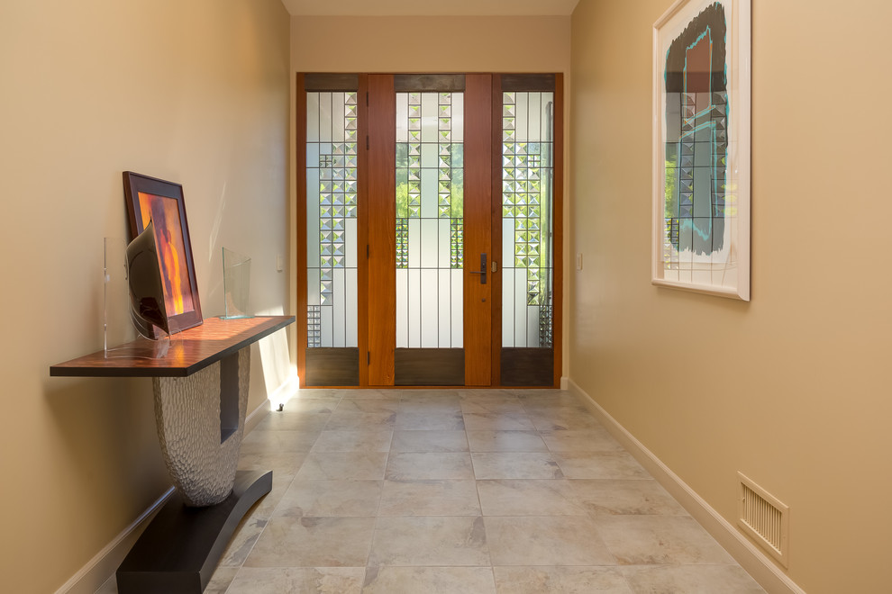 Mid-sized transitional front door in Santa Barbara with beige walls, porcelain floors, a single front door, a glass front door and beige floor.