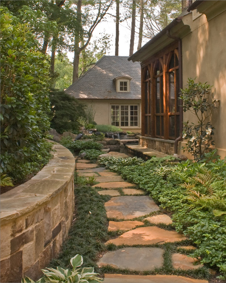 Traditional side yard shaded garden in Atlanta with a water feature.