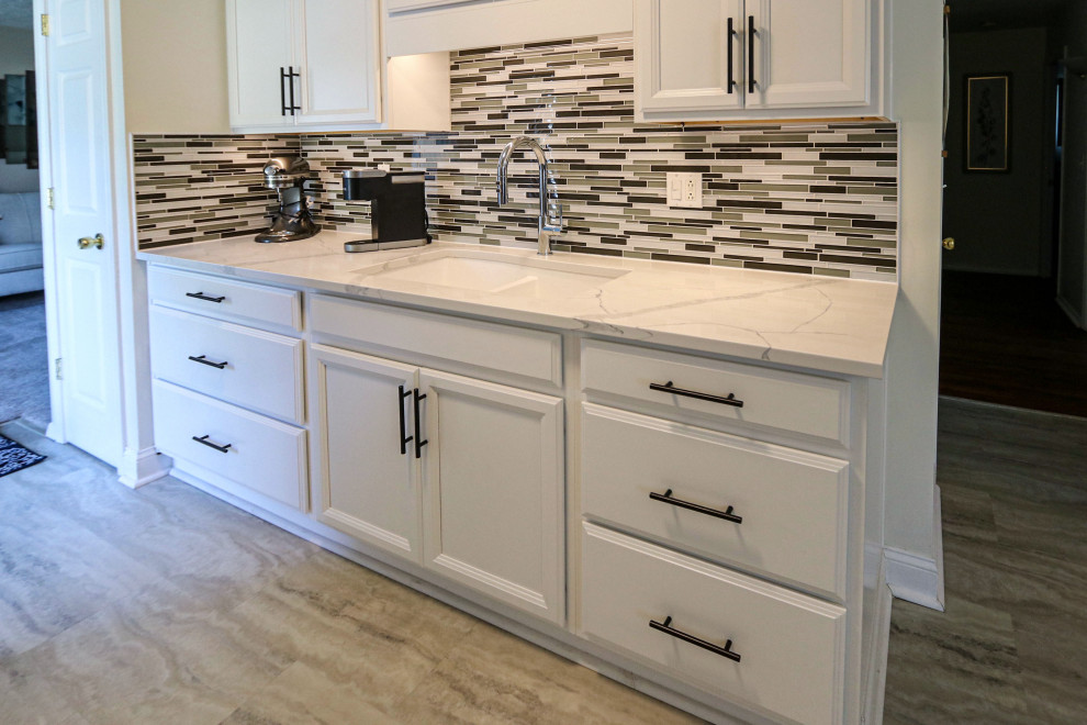 White Kitchen with Quartz Countertop and Mosaic Tile Backsplash ...