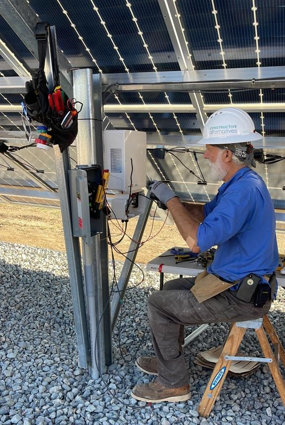 man working on solar