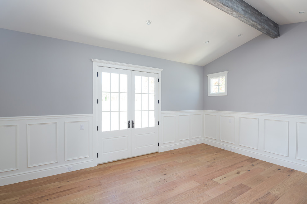 Large transitional master light wood floor home design photo in Phoenix with blue walls and no fireplace