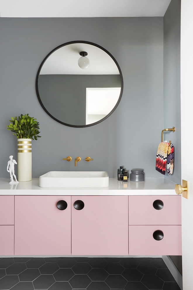 Inspiration for a mid-sized contemporary bathroom in Los Angeles with flat-panel cabinets, grey walls, porcelain floors, grey floor, white benchtops, a single vanity, a vessel sink and a floating vanity.