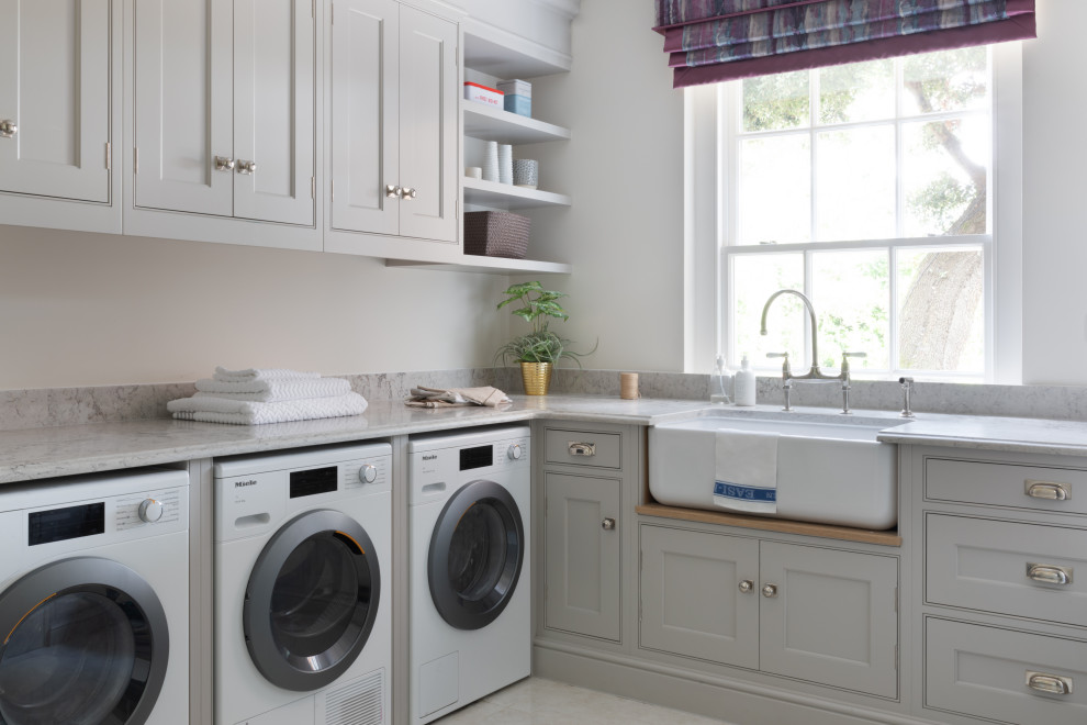Design ideas for an expansive classic u-shaped utility room in Surrey with a built-in sink, all styles of cabinet, marble worktops, beige splashback, mosaic tiled splashback, ceramic flooring, beige floors and purple worktops.