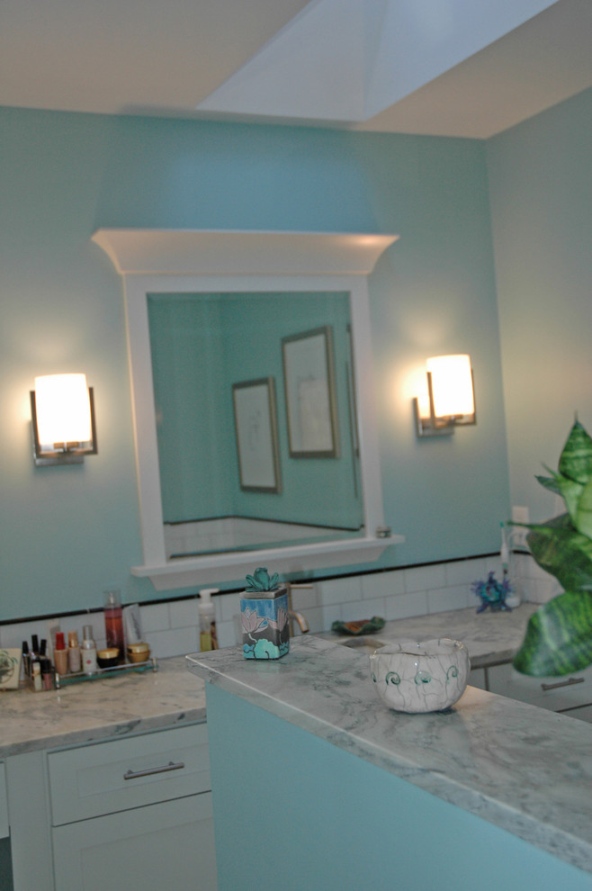 Inspiration for a mid-sized transitional master white tile and subway tile porcelain tile and gray floor alcove bathtub remodel with shaker cabinets, white cabinets, a two-piece toilet, blue walls, an undermount sink, marble countertops and white countertops