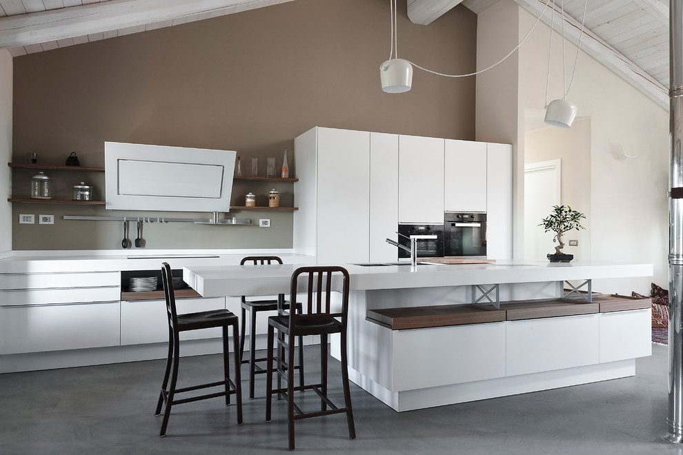Inspiration for a contemporary galley open plan kitchen in Turin with flat-panel cabinets, white cabinets and with island.