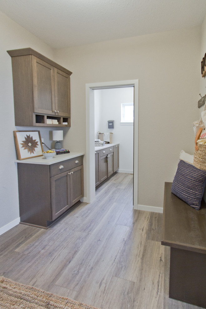 Example of a transitional brown floor and vinyl floor entryway design