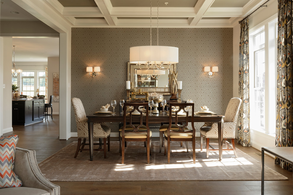 This is an example of a traditional dining room in DC Metro with brown walls, medium hardwood floors and brown floor.