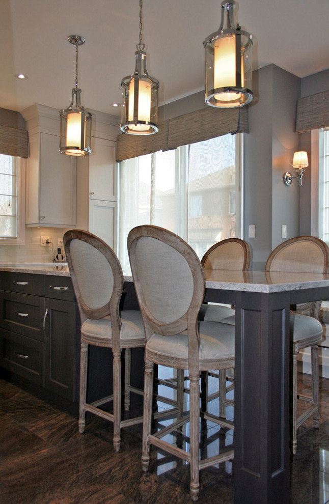 Example of a transitional kitchen design in Toronto