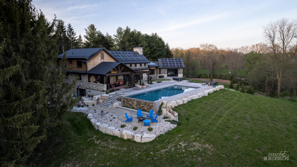 Mountain style pool photo in Toronto