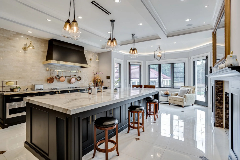 Inspiration for a transitional beige floor kitchen remodel in Baltimore with black cabinets, beige backsplash, an island and beige countertops