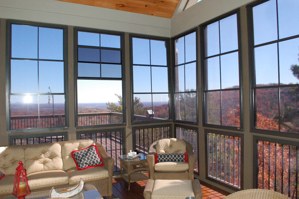 This is an example of a large sunroom in Philadelphia with medium hardwood floors and a standard ceiling.