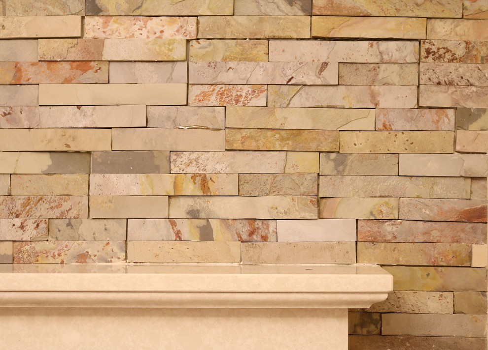 Photo of a medium sized contemporary formal enclosed living room in Other with beige walls, laminate floors, a standard fireplace, a tiled fireplace surround, a freestanding tv and beige floors.