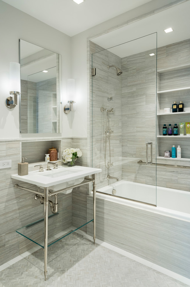 Inspiration for a mid-sized transitional master bathroom in New York with gray tile, stone tile and glass benchtops.