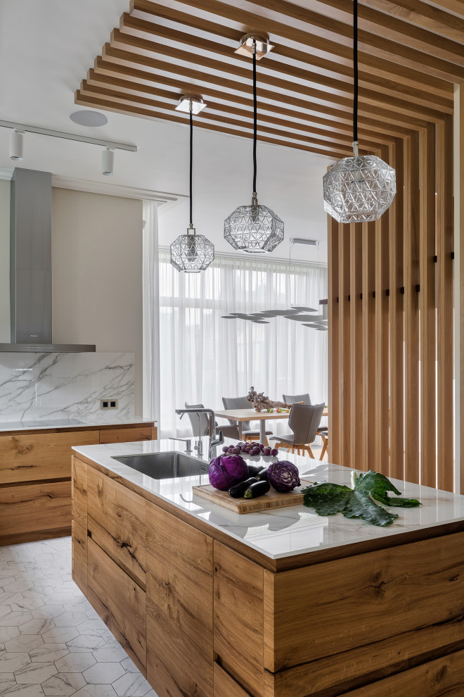 Large contemporary l-shaped open plan kitchen in Saint Petersburg with light wood cabinets, marble benchtops, white splashback, marble splashback, white appliances, porcelain floors, with island, white floor, white benchtop and wood.