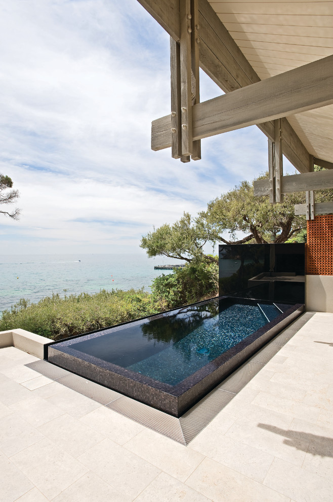 Inspiration for a small contemporary rectangular pool in Sydney.