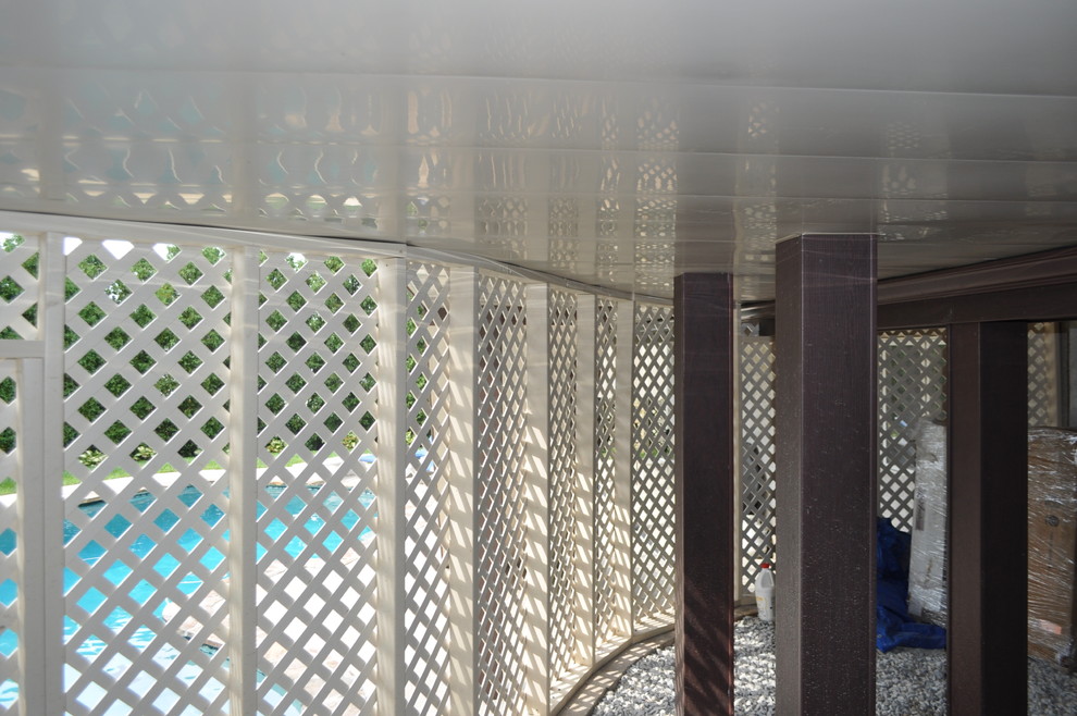 Mid-sized transitional backyard deck photo with no cover