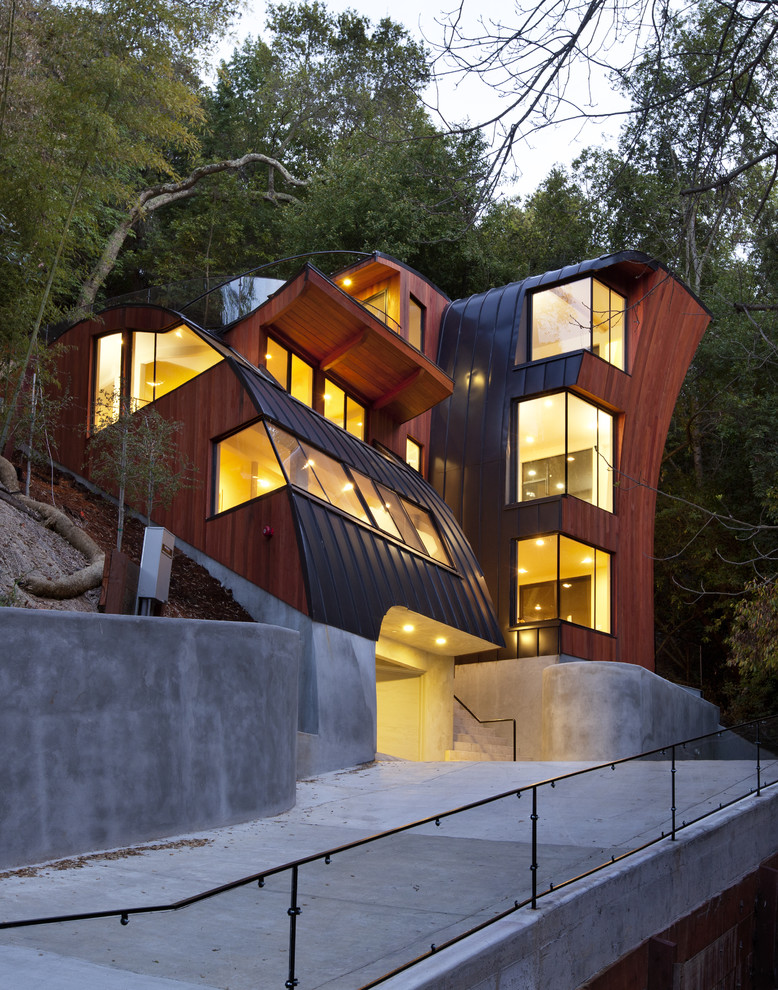 This is an example of a contemporary three-storey exterior in San Francisco with wood siding.