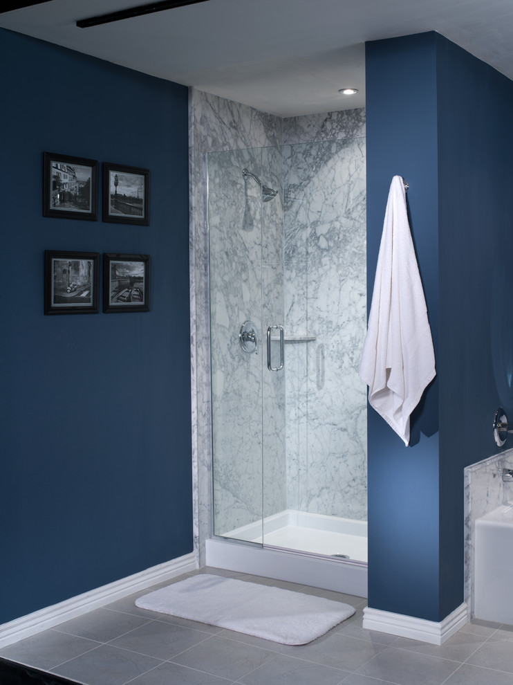 This is an example of a mid-sized modern master bathroom in Detroit with white tile, stone slab and blue walls.