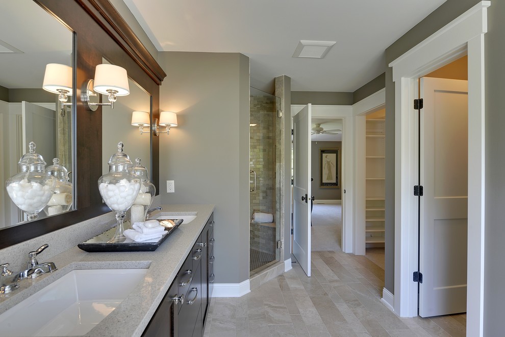 Inspiration for a traditional bathroom in Minneapolis with a corner shower, an undermount sink and beige floor.