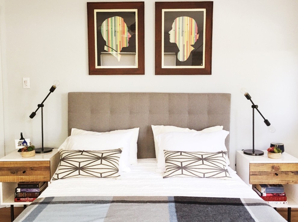 Mid-sized midcentury master bedroom in Atlanta with white walls, medium hardwood floors and no fireplace.