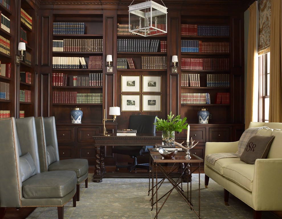 This is an example of a mid-sized traditional study room in Houston with a freestanding desk and dark hardwood floors.
