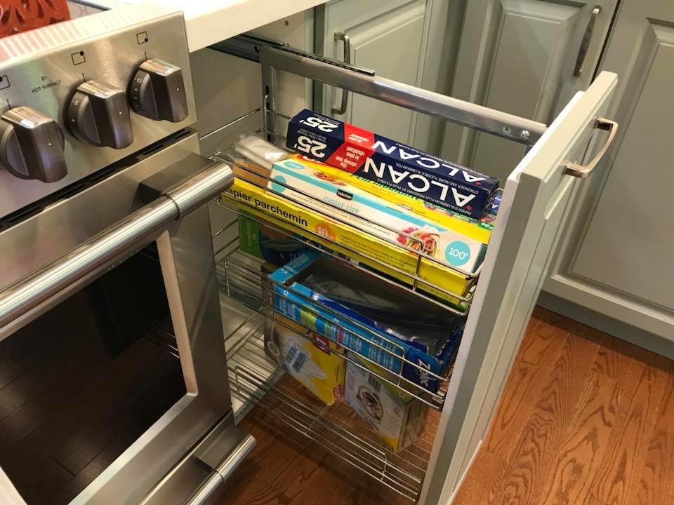 Eat-in kitchen - transitional u-shaped medium tone wood floor eat-in kitchen idea in Toronto with an undermount sink, raised-panel cabinets, white cabinets, quartz countertops, white backsplash, porcelain backsplash, stainless steel appliances, no island and white countertops