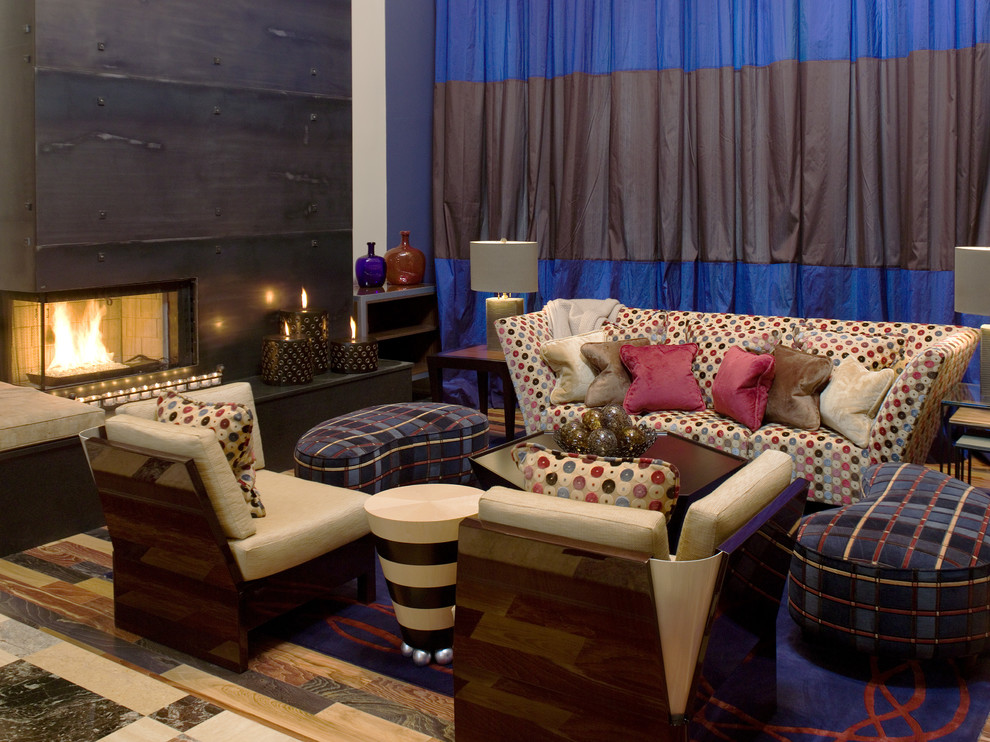 Contemporary living room in Charlotte with a standard fireplace and a metal fireplace surround.