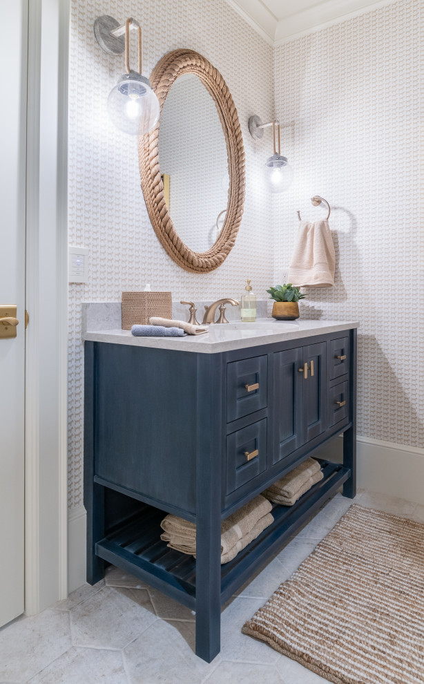 Inspiration for a small shower room bathroom in Grand Rapids with beaded cabinets, blue cabinets, white walls, ceramic flooring, a submerged sink, engineered stone worktops, beige floors, beige worktops, a feature wall, a single sink, a built in vanity unit and wallpapered walls.