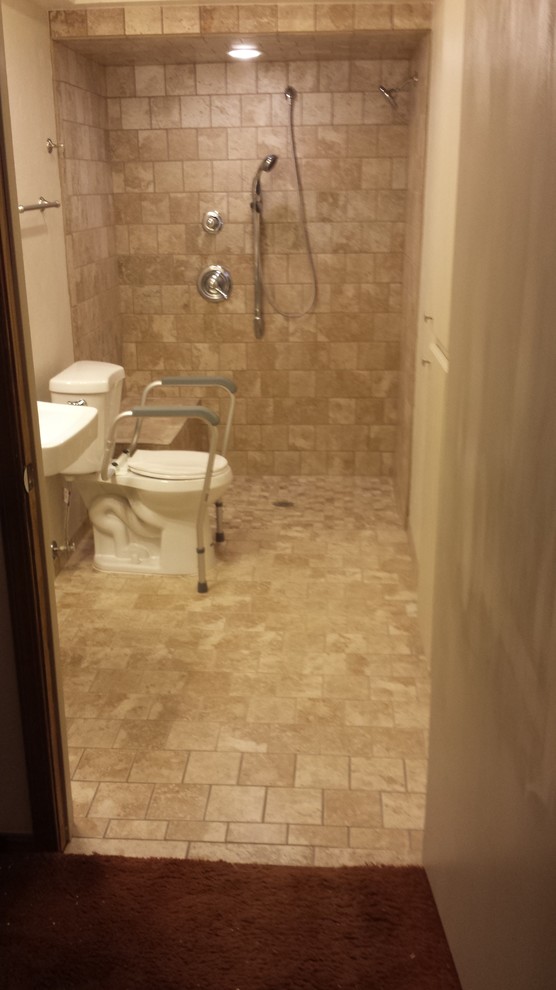 This is an example of a mid-sized transitional master bathroom in Oklahoma City with an open shower, brown tile, brown walls, ceramic floors and a wall-mount sink.