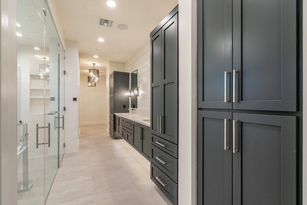 Inspiration for a master double-sink and shiplap wall freestanding bathtub remodel in Phoenix with a floating vanity