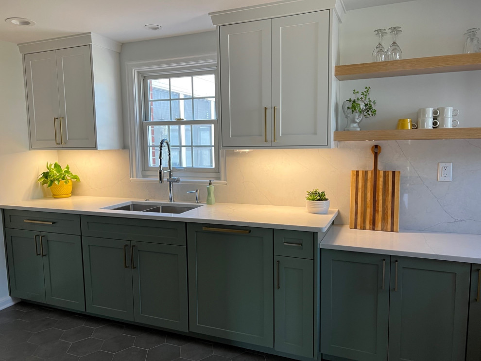 Photo of a small transitional galley separate kitchen in Indianapolis with an undermount sink, shaker cabinets, green cabinets, quartz benchtops, white splashback, engineered quartz splashback, stainless steel appliances, porcelain floors, no island, grey floor and yellow benchtop.
