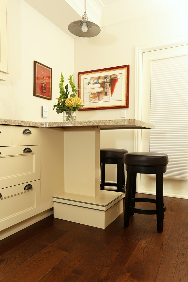 Small transitional galley medium tone wood floor and brown floor enclosed kitchen photo in Toronto with a double-bowl sink, shaker cabinets, beige cabinets, quartz countertops, beige backsplash, ceramic backsplash, stainless steel appliances and a peninsula
