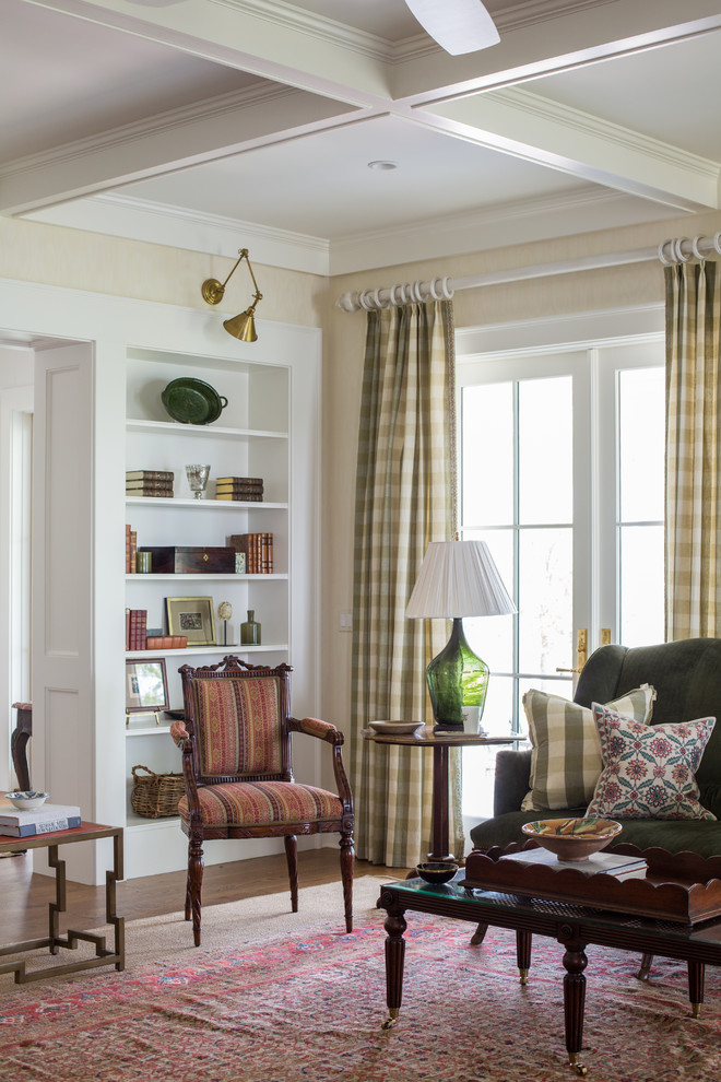 Inspiration for a timeless formal and enclosed medium tone wood floor and brown floor living room remodel in Jacksonville with beige walls, no fireplace and no tv